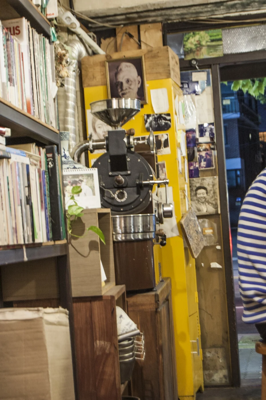 Bookshelves and a roasting machine inside a Seoul bookshop café. Photographed 9 October 2015.
