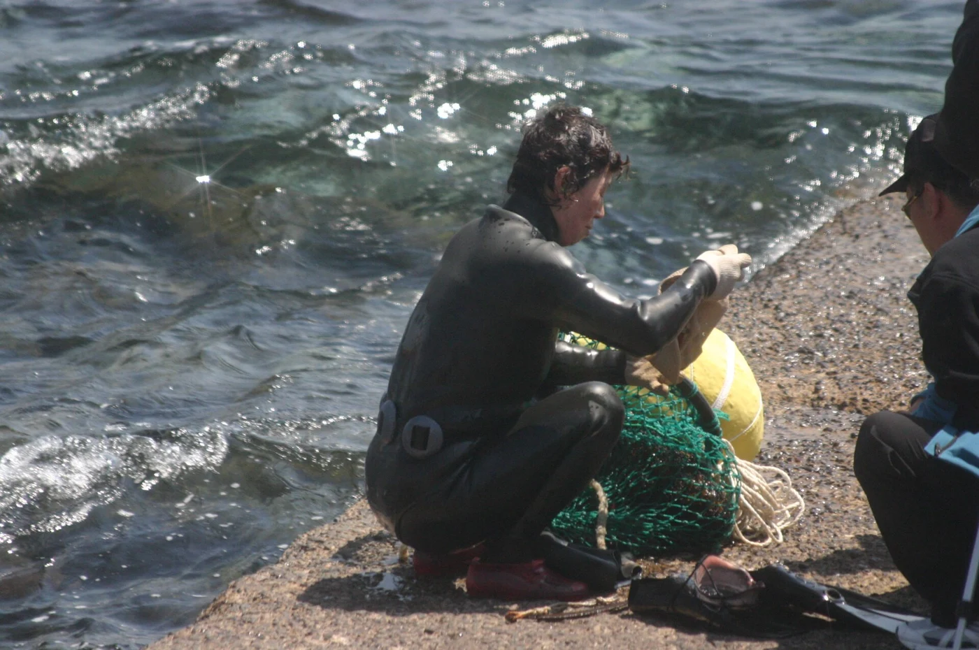 Jeju haenyeo with float and collecting net. karendotcom127, 2007.