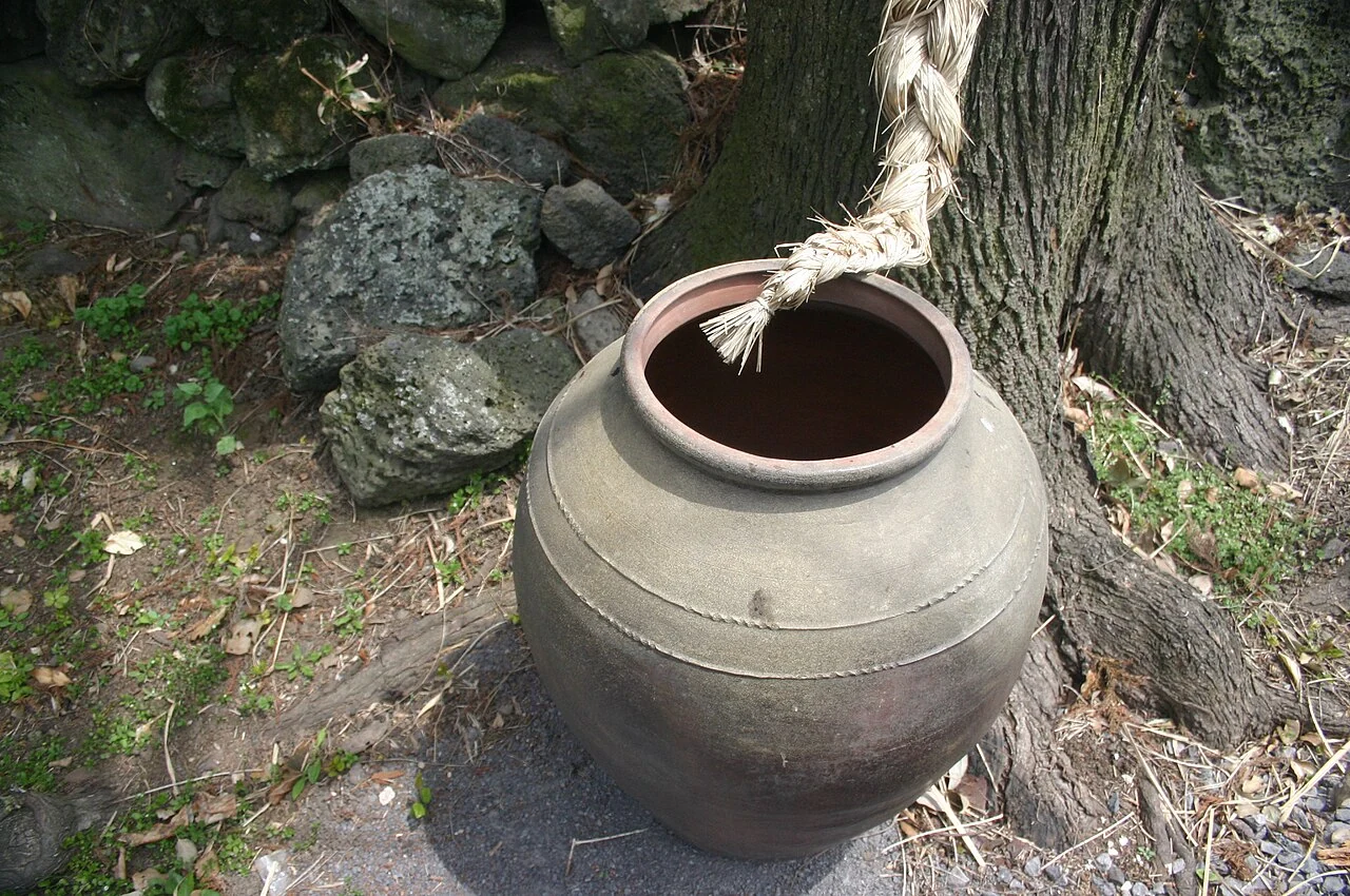 The rounded body and mouth of an onggi jar